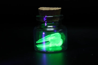 Mini Uranium Glass Tooth in Bottle, Tooth Fairy Keepsake, UV Reactive Tiny Tooth