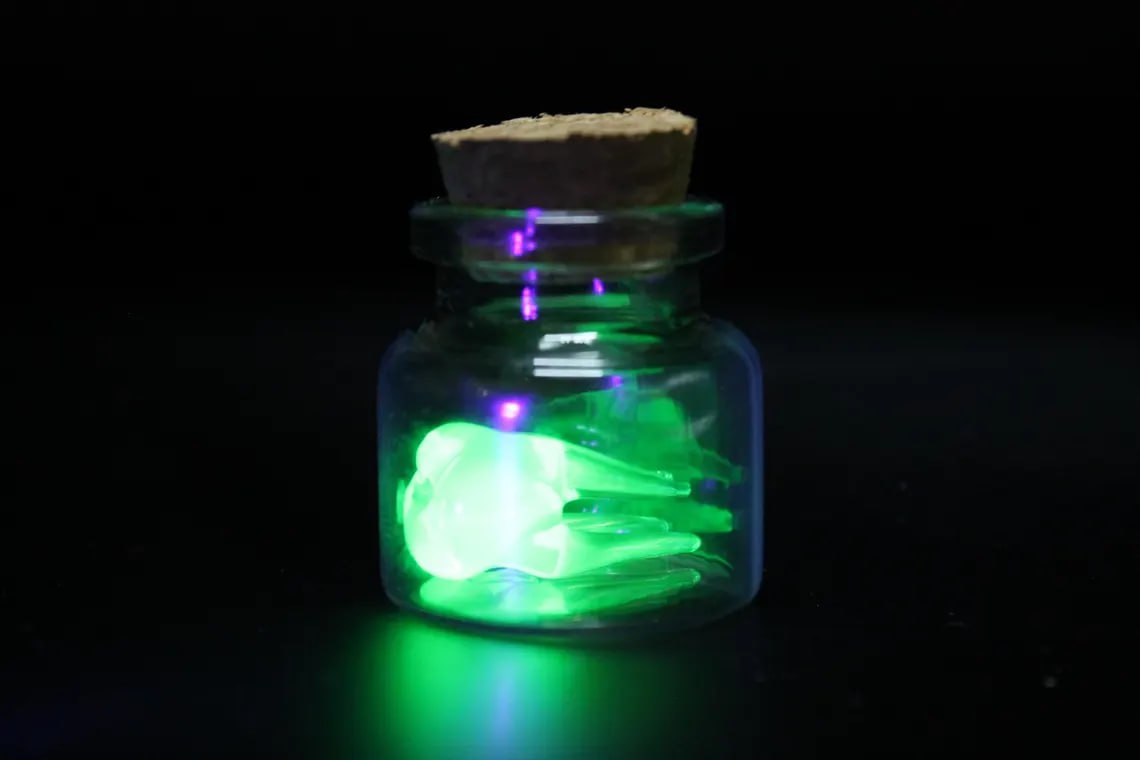 Mini Uranium Glass Tooth in Bottle, Tooth Fairy Keepsake, UV Reactive Tiny Tooth