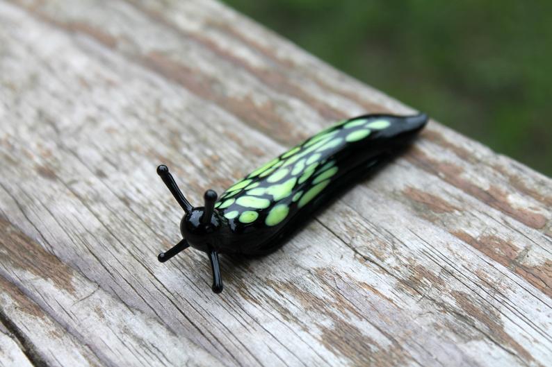 Black And Green Glass Slug Figurine – Bright Miniature Artwork