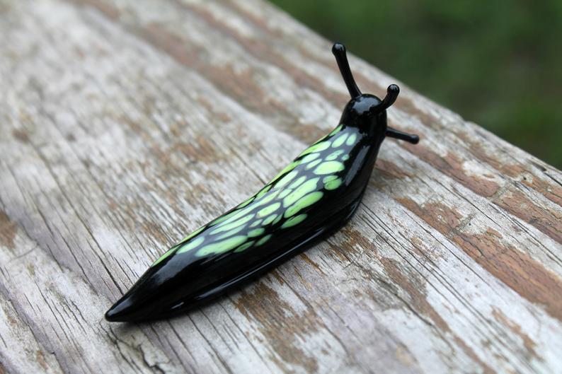 Black And Green Glass Slug Figurine – Bright Miniature Artwork
