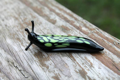 Black And Green Glass Slug Figurine – Bright Miniature Artwork